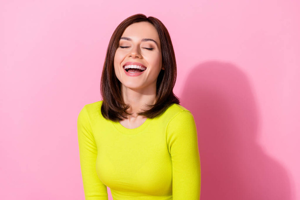 Photo of charming funny lady wear yellow top closed eyes laughing isolated pink color background. - Foto, imagen
