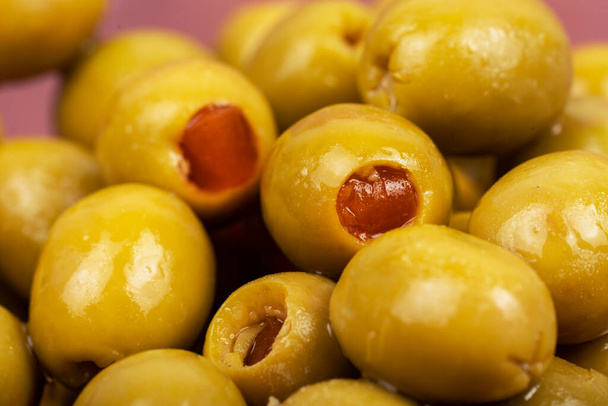 Green olives with pimento in a bowl. - Photo, Image