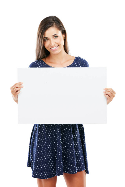 I totally support this. Studio portrait of an attractive young woman holding a blank placard against a white background - Foto, imagen