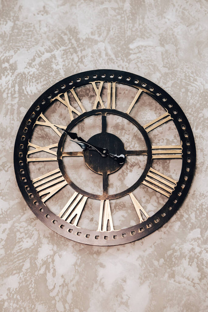 Antique retro wooden clock hanging on the wall in flat or house - Photo, Image