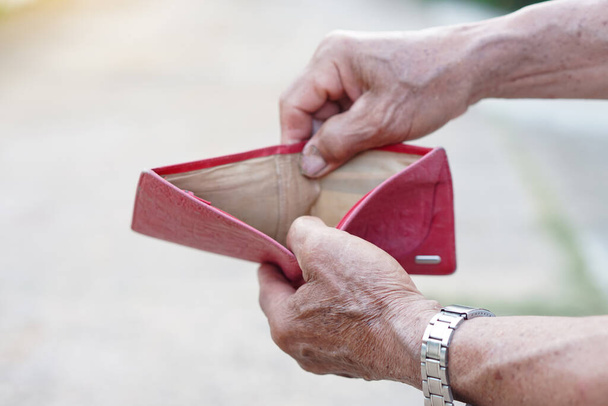 Closeup senior' man hands open empty wallet. Concept, no money, economic crisis. Financial problems. - Fotó, kép