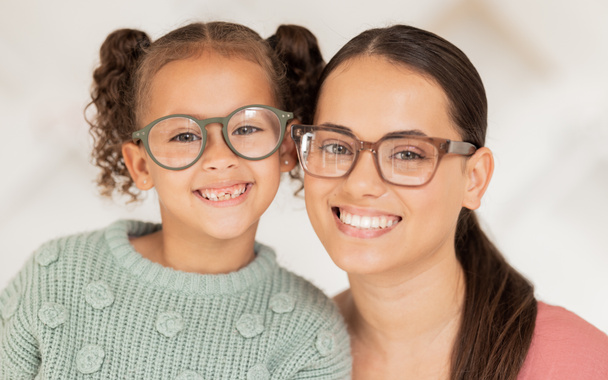 Mother, girl and glasses in optometry shop, frame and happy after shopping in retail store with smile for vision result. Portrait of latino mom, child and happiness with optical lense at optometrist. - Zdjęcie, obraz