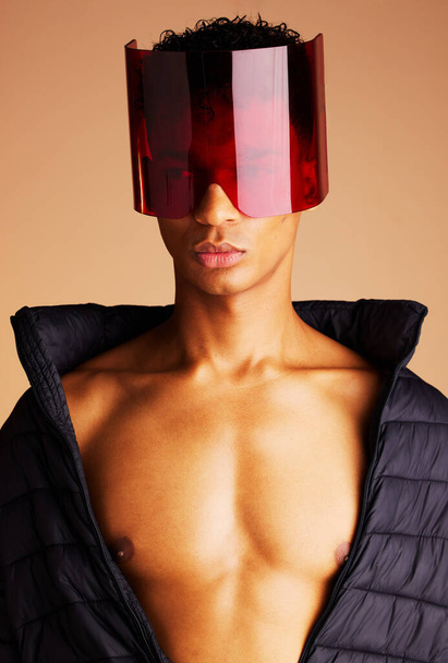 Beauty, futuristic fashion and man in sunglasses with creative cyberpunk style, modern accessory and trend setting sci fi eyewear. Black man, artistic red glass visor and future of edgy new clothing. - Photo, Image