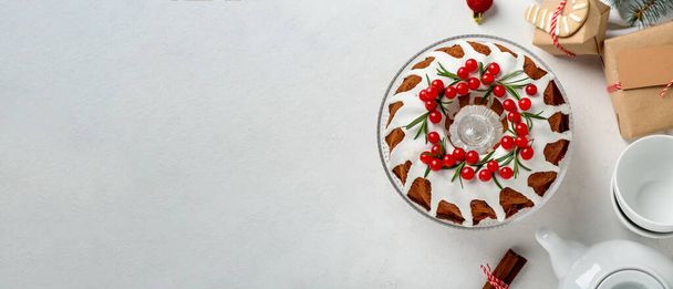 Tasty Christmas cake with cranberry on light background with space for text, top view - Photo, Image