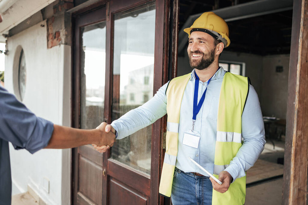 Construction, architect and handshake deal at building for professional contract, trust and welcome. Architecture, house and renovation planning agreement with expert worker man on site - 写真・画像
