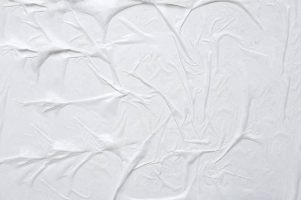 wit verfrommeld en gerimpeld papier poster textuur achtergrond - Foto, afbeelding