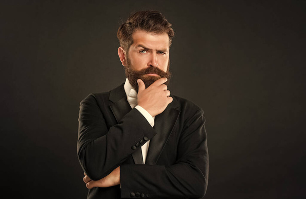 bearded businessman in tuxedo on black background, fashionist. - Zdjęcie, obraz
