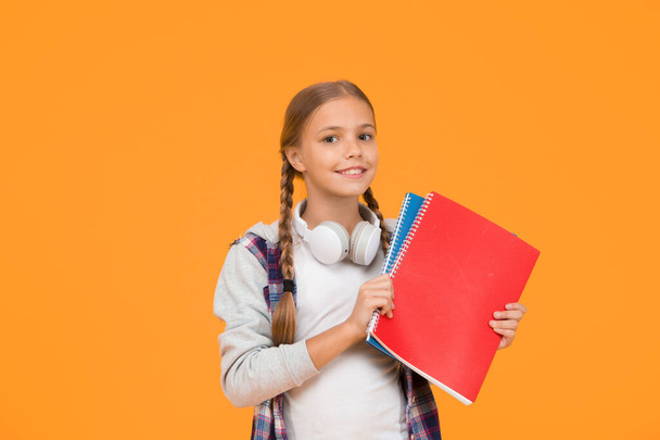 Free courses. Welcome back to school. Motivate kids for academic year ahead. School girl hold books. School lesson. Study literature. Towards knowledge. Learn following rules. Modern school student. - Фото, зображення