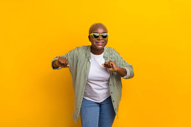 Portrait of nice satisfied person enjoy entertainment clubbing dancing isolated on yellow color background. - Foto, afbeelding