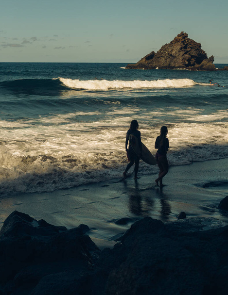 SURF COUPLE IN A BEACH - Photo, Image