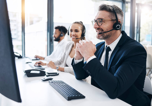 Call center, man and customer service with contact us, telemarketing advice in crm support office. Computer, headset and male agent consulting for helpline or operator help online in the office. - Фото, изображение