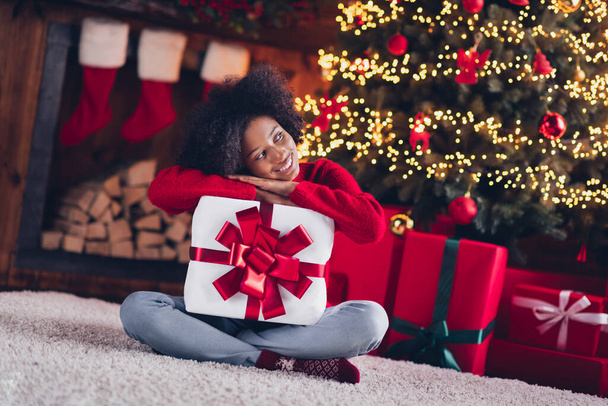 Photo of pretty cute dreamy child teenager sit floor room hold package look snow empty space wait santa claus miracle enjoy cozy time home. - Foto, Imagem
