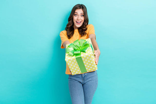 Photo of young adorable pretty cute nice student girl wear stylish outfit excited crazy hold gift surprised unexpected isolated on aquamarine color background. - Photo, Image