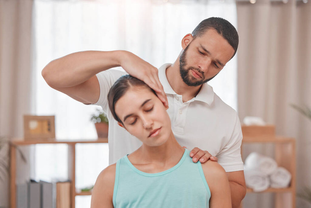 Physiotherapy, neck injury and woman in a consultation room with physiotherapist man for spine, back and bone assessment. Neck pain, girl and doctor in an exam for posture, joint and muscle problem. - Photo, Image