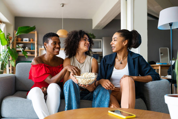 Happy beautiful hispanic south american and black women meeting indoors and having fun - Black adult females best friends spending time together, concepts about domestic life, leisure, friendship and togetherness - Fotoğraf, Görsel