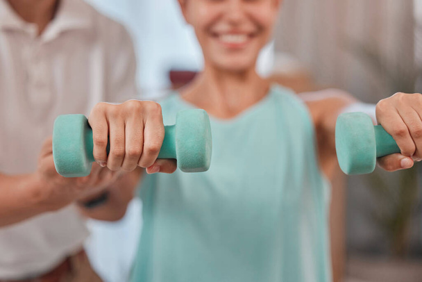 Woman, hands or dumbbell exercise in physiotherapy, muscle rehabilitation or healthcare wellness for accident or sports injurty recovery. Zoom, physiotherapist or man helping patient in weightlifting. - Foto, immagini