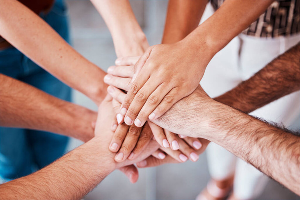 Top view, hands and together to connect, for support and solidarity and team building for success, agreement and being community. Hand gesture, group stack pile and connection for loyalty and unity - Foto, Bild