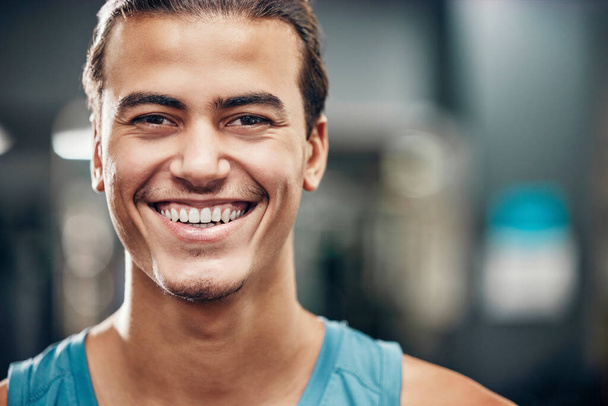 Portrait, gym and sports man with smile for wellness, fitness and healthy lifestyle, wellness with motivation, commitment and our vision. Face of an athlete with workout, exercise or training mission. - Foto, Bild