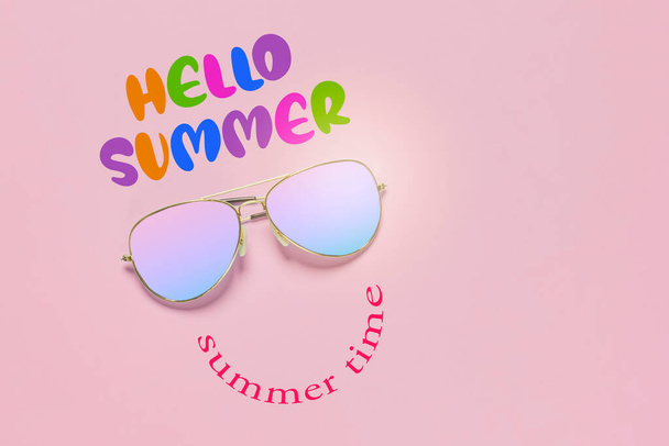 sunglasses with the words hello summer written on it and an image of a smiley face made out of rainbow colored glasses - Photo, Image