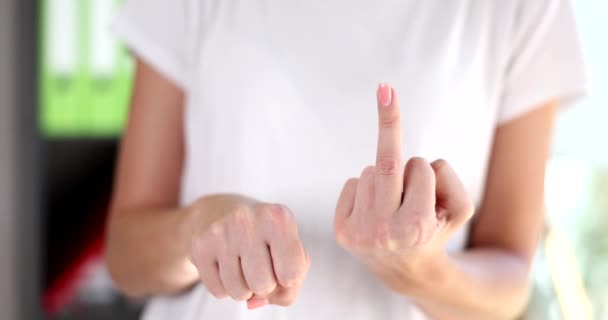 Closeup of woman showing middle finger making fuck you gesture. Concept of bad and offensive expressions - Video