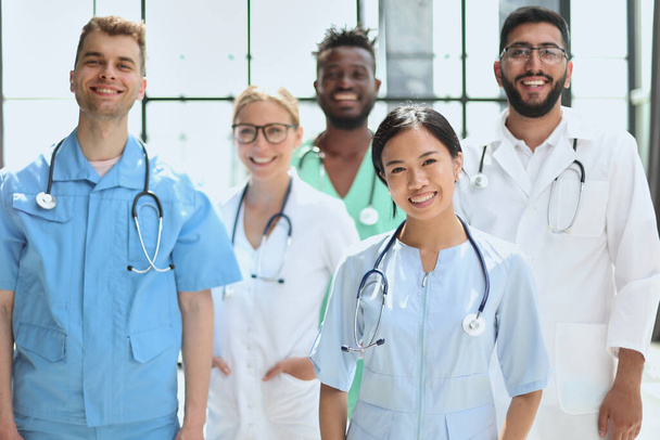 multinational group of doctors and interns standing together. - Фото, изображение