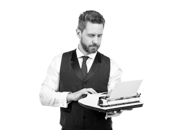 busy man typing on vintage typewriter. businessman with retro typewriter. typist author isolated on white background. bookman or novelist. secretary working in publishing. - Fotó, kép