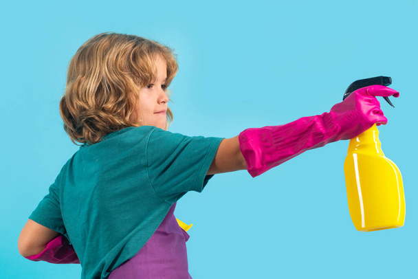 Child doing housework. Studio portrait of child use duster and gloves for cleaning. Funny child mopping house. Cleaning accessory, cleaning supplies. Housekeeping and home cleaning - Φωτογραφία, εικόνα