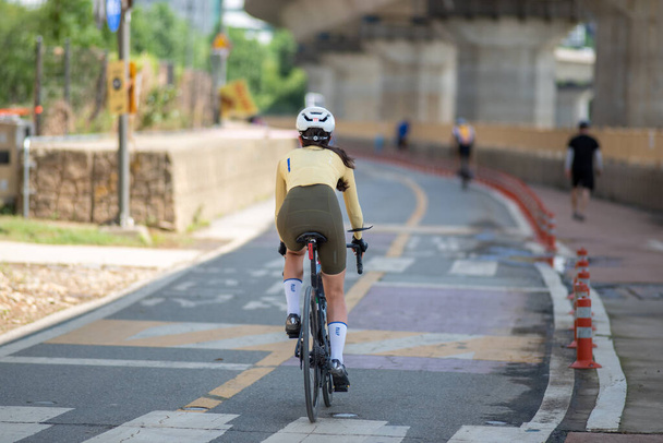 Cyclist on Hangang Han river bicycle path in Seoul South Korea on 20 August 2022 - Fotografie, Obrázek