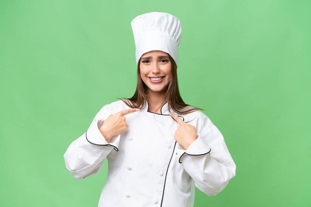 Young chef caucasian woman over isolated background with surprise facial expression - Photo, Image