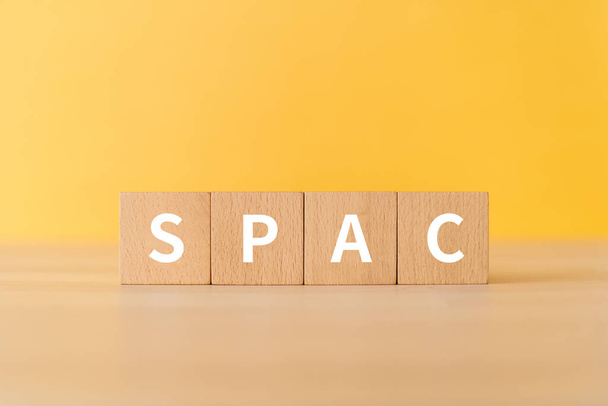 Wooden blocks with "SPAC" text of concept. - Photo, image