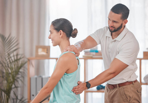 Chiropractor, woman and massage for physical therapy, health and posture at wellness clinic. Doctor, girl and spine alignment for medical, chiropractic or rehabilitation with help in physiotherapy. - Φωτογραφία, εικόνα