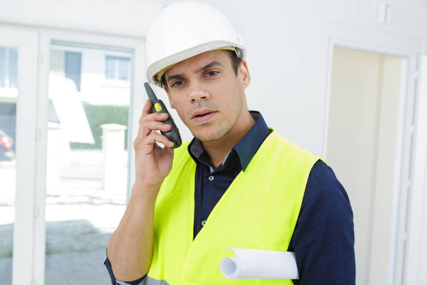 male engineer using a walkie talkie - Photo, image