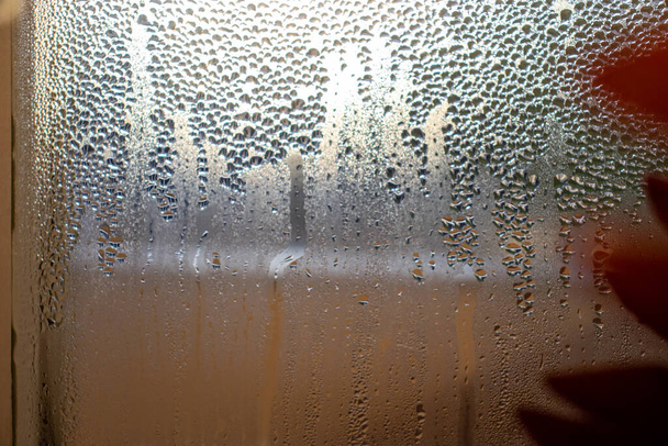 Window with condensate or steam after heavy rain texture. leaky windows in the house - Photo, Image