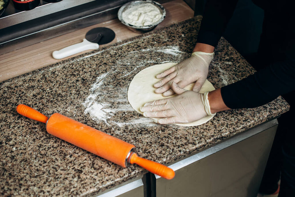 Pizza dough. The process of preparing pizza - Photo, Image