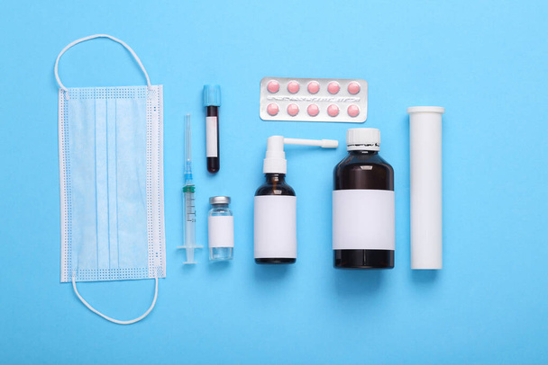 Flat lay composition of medical supplies on a blue background. top view - Valokuva, kuva