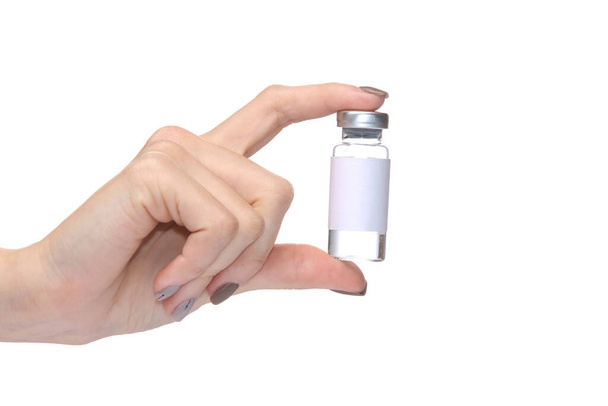 Frasco de mano femenina de vacuna aislada sobre fondo blanco - Foto, Imagen