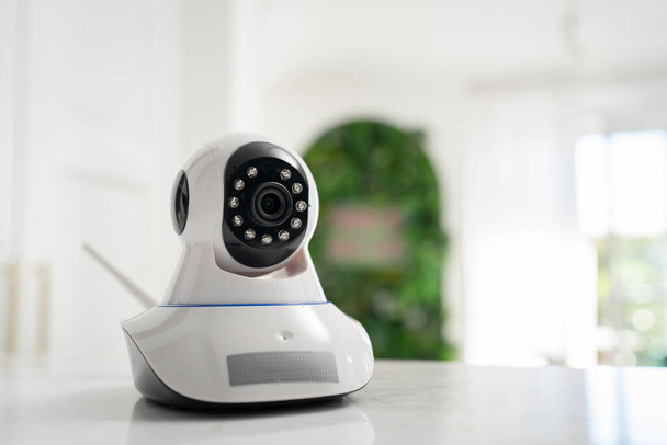 Security camera high tech smart home security technology digital on the table or shelf copy space - 写真・画像