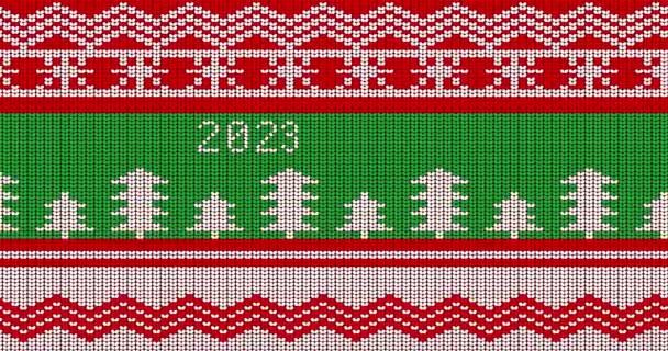 Ugly sweater animated video with number 2023. Animation of Winter knitted sweater pattern in red, white and green. - Footage, Video