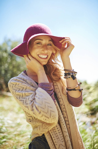 Today is all about being free. Portrait of an attractive young woman in a sunhat standing outside - Foto, Imagem
