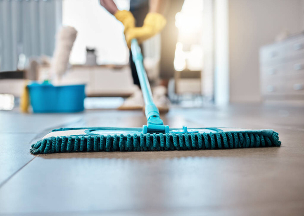 Man, mopping or cleaning floor in house, home or hospitality hotel for housekeeping product service, maid or worker. Zoom, cleaner or bacteria spring clean, hygiene health or living room maintenance. - Foto, immagini