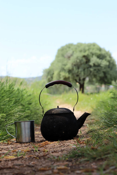 black camping teapot and metal cup - Photo, Image