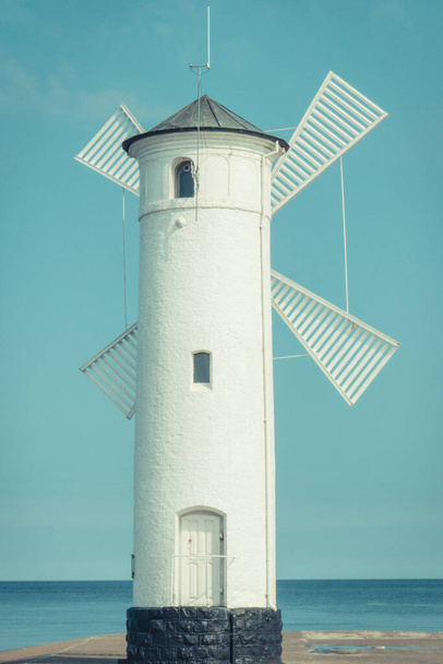 Swinoujscie, West Pomeranian - Poland - June 8, 2022: View on windmill Stawa Mlyny as charateristic navigational mark. Tourist attraction in Swinoujscie - Foto, immagini