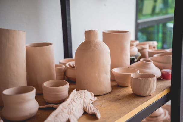 Ceramic vase on the table at the workshop. - Фото, зображення