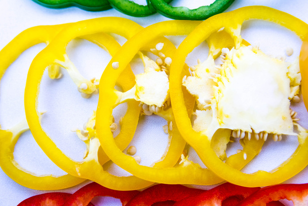 red, green, yellow, orange bell pepper slices - Photo, image