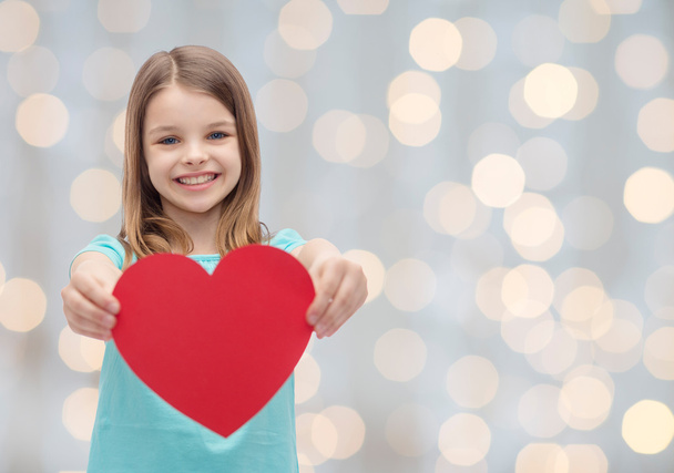 smiling little girl with red heart - Foto, imagen