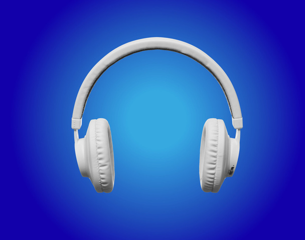 Valkoinen kuulokkeet sininen valokeila tausta
 - Valokuva, kuva