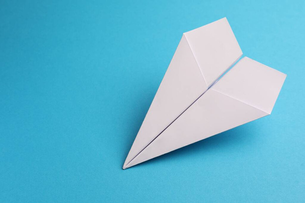 Handmade white paper plane on light blue background, space for text - Фото, зображення