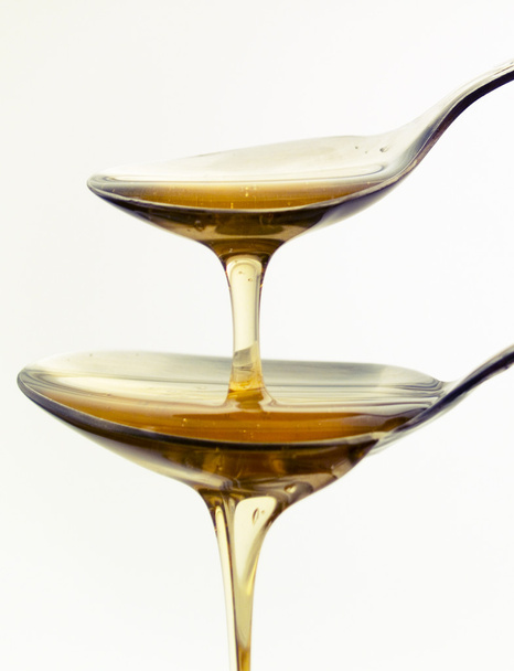 Two spoons with honey - Foto, imagen