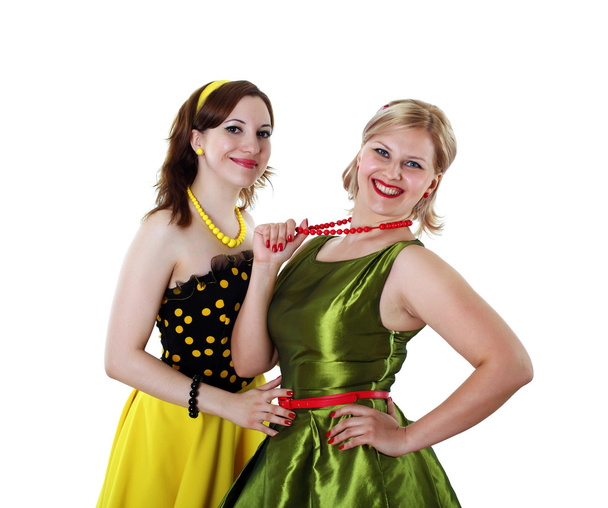 Two young woman in bright colour dresses - Foto, Imagen