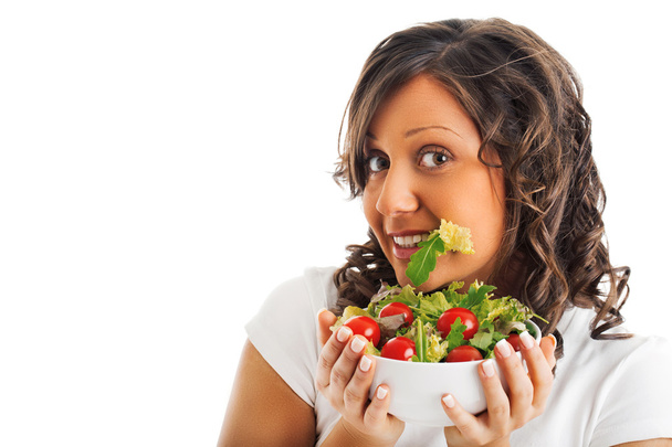 Young woman eating healthy salad - Foto, Imagen